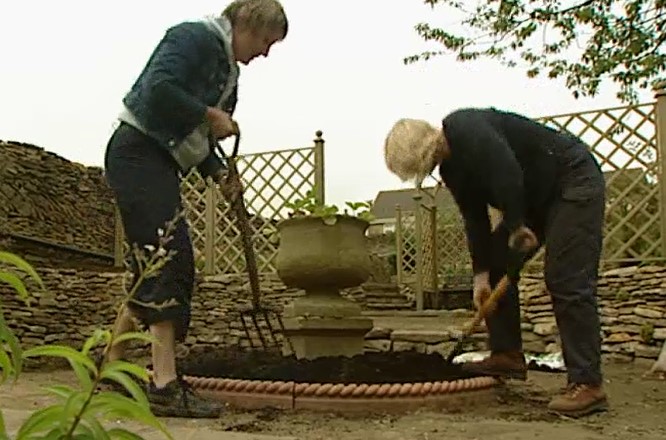 Digging out around the urn Digging out around the urn