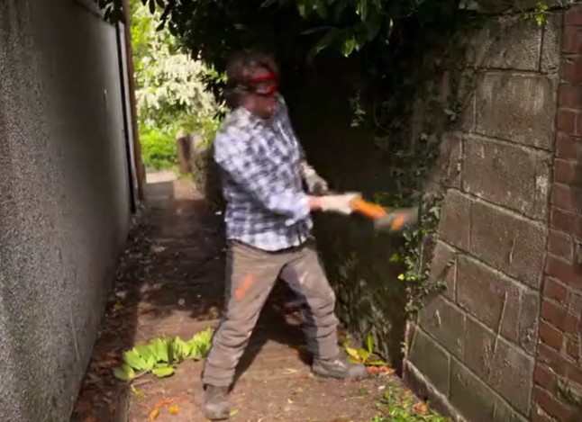 David uses a sledge hammer to break down the wall David uses a sledge hammer to break down the wall
