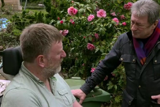 Alan speaks to Chris in the garden Alan speaks to Chris in the garden