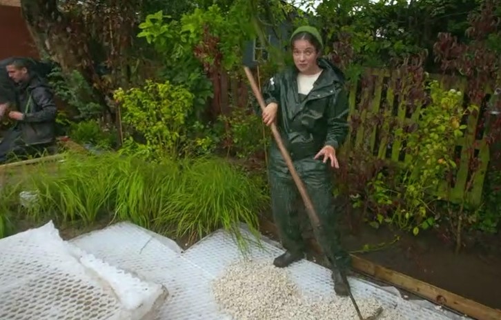 Frances lays the gravel