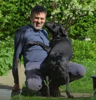 Adam and Mo the dog playing